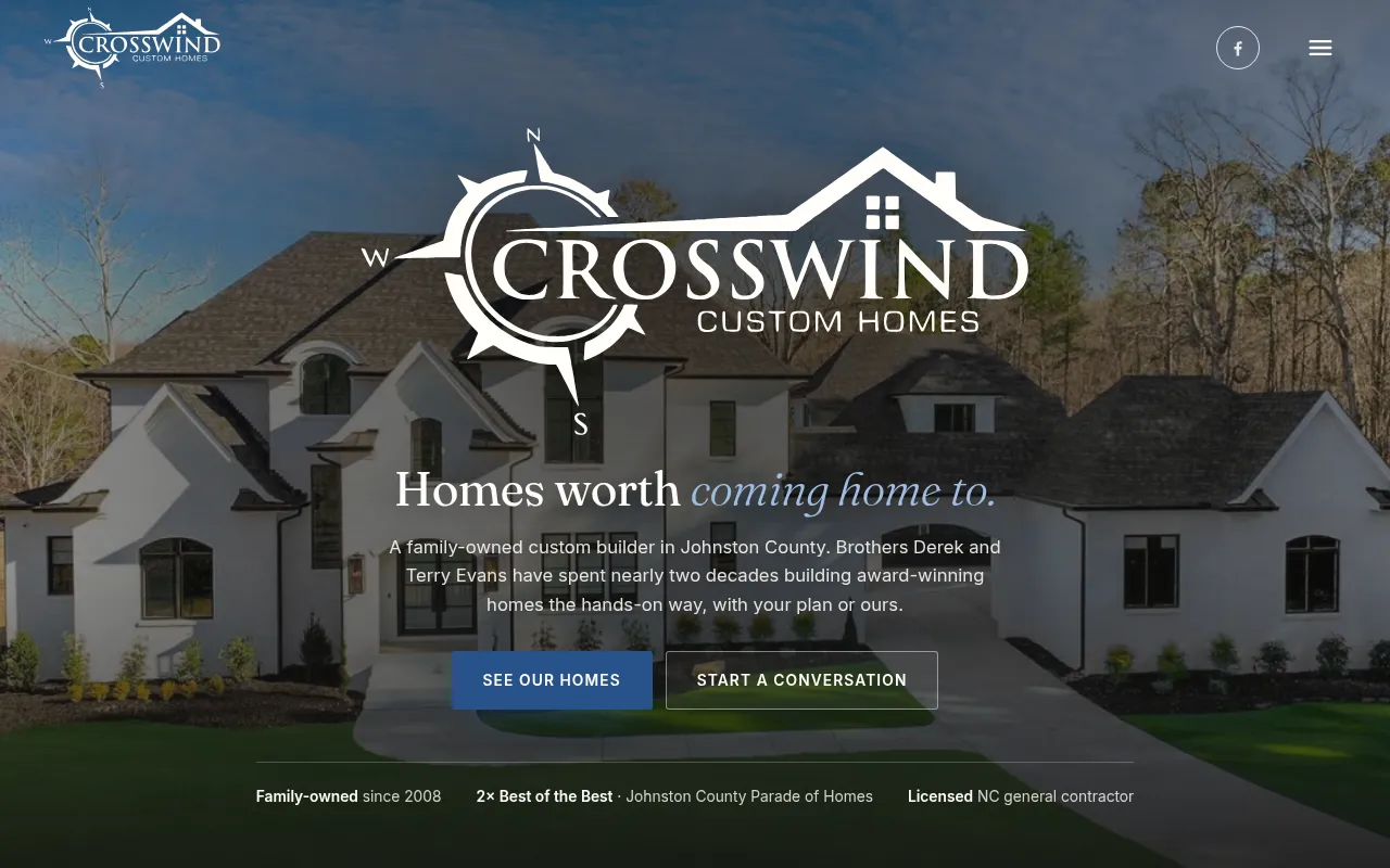 The new Crosswind home page: their logo centred over a large white finished home, with Homes worth coming home to, two buttons and a line of credentials beneath.